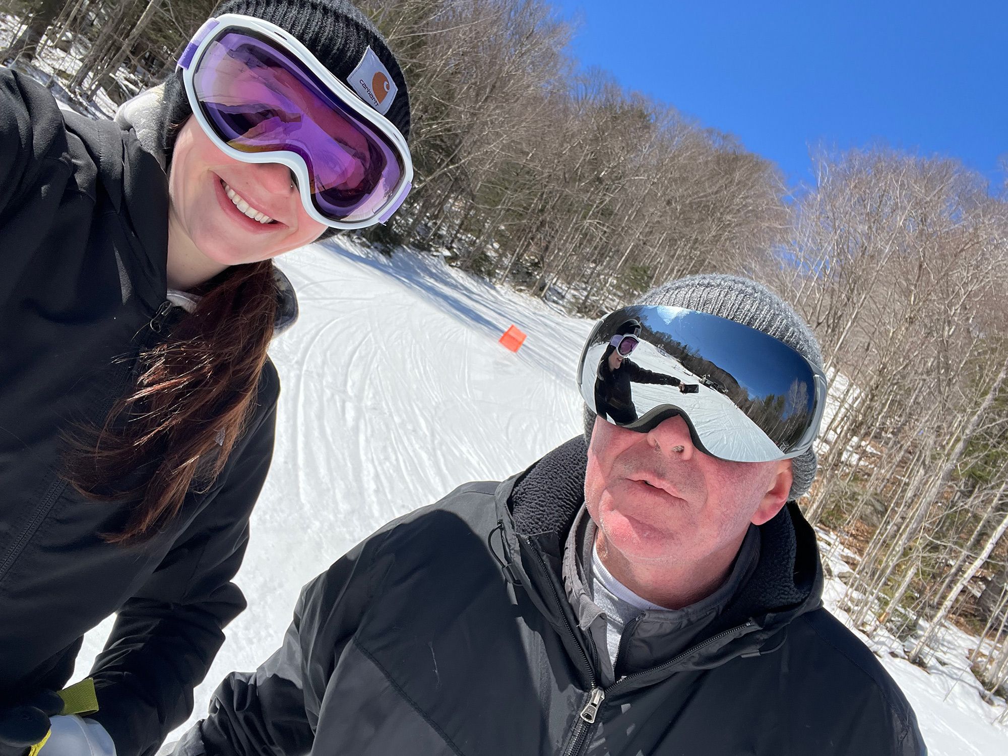 picture of young woman and man smiling at camera