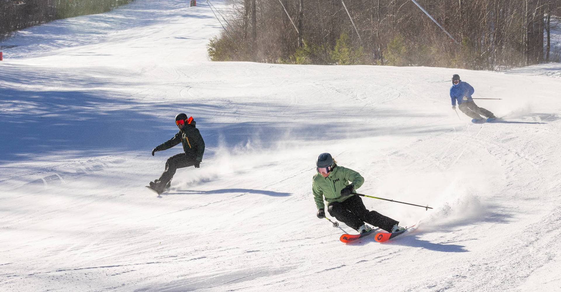 group of skiers and snowboarders