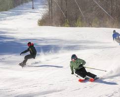 3 people skiing