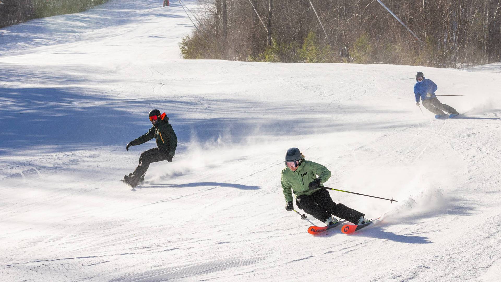 group of skiers and snowboarders