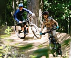group of mountain bikers underneath the Gondola
