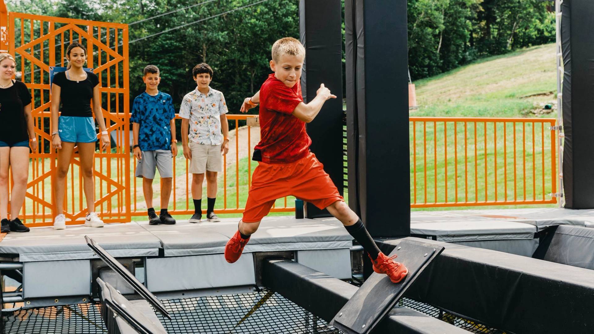 boy navigating the Ninja Wild obstacle course