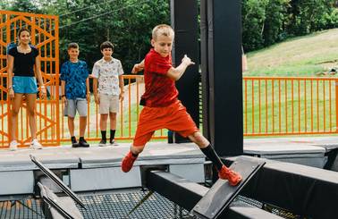 boy navigating the Ninja Wild obstacle course