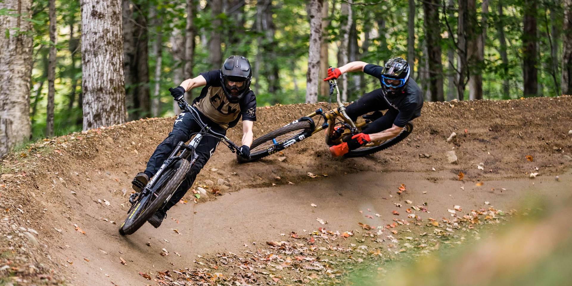 Downhill mountain biker riding a berm in Loon Bike Park