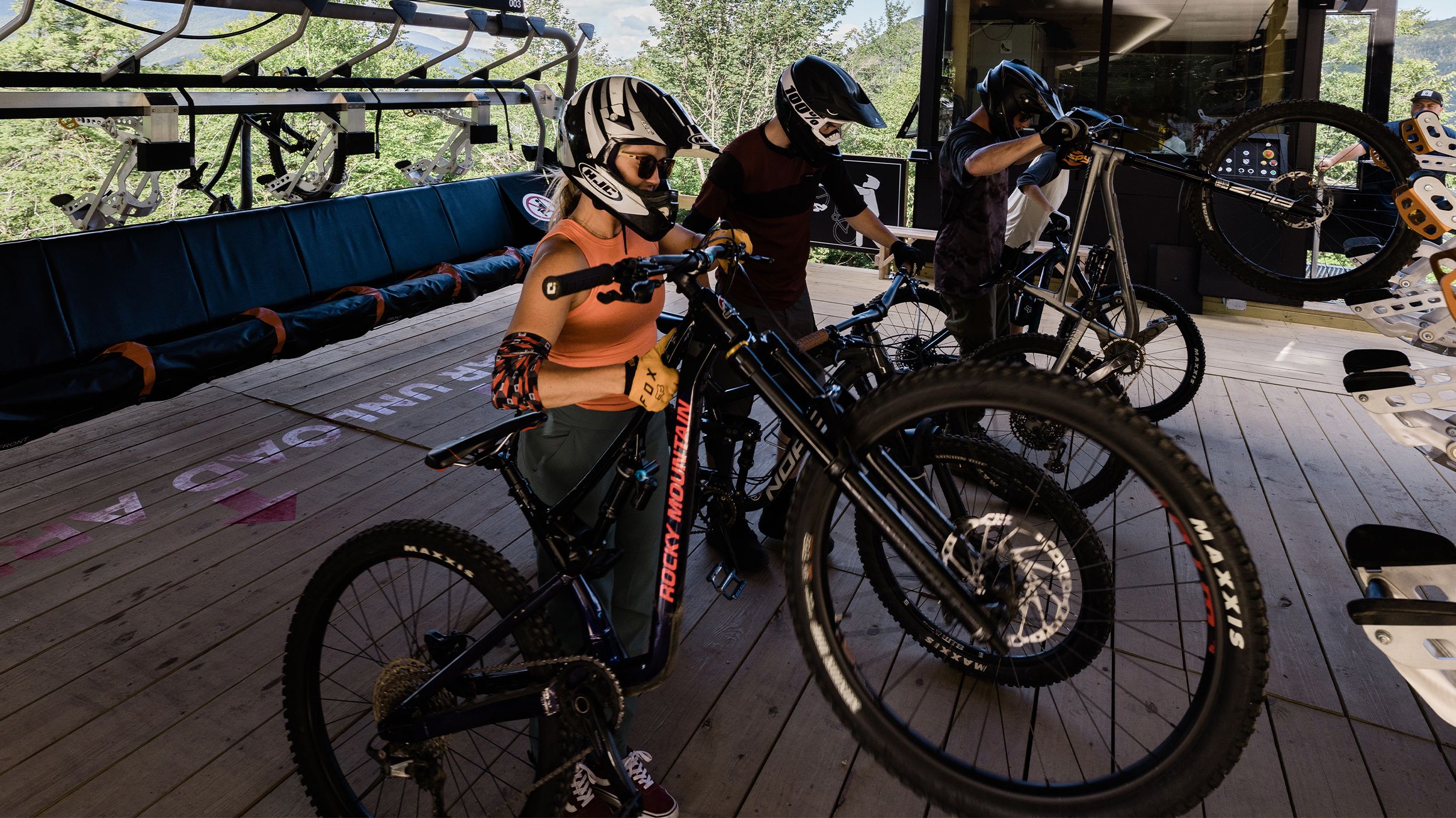 female biker unloading bike off Kancamagus 8
