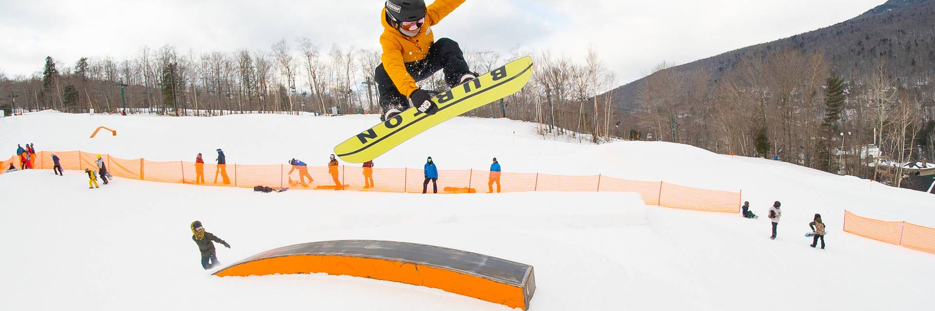Young snowboarder performing a grab
