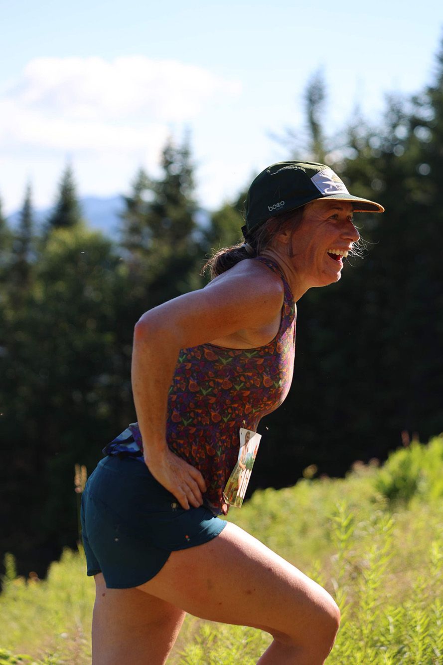 side view of female runner smiling