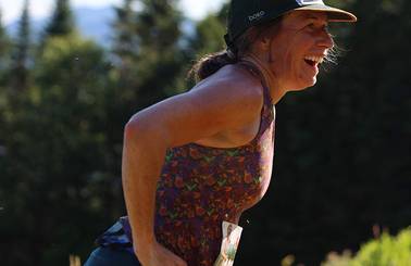 side view of female runner smiling