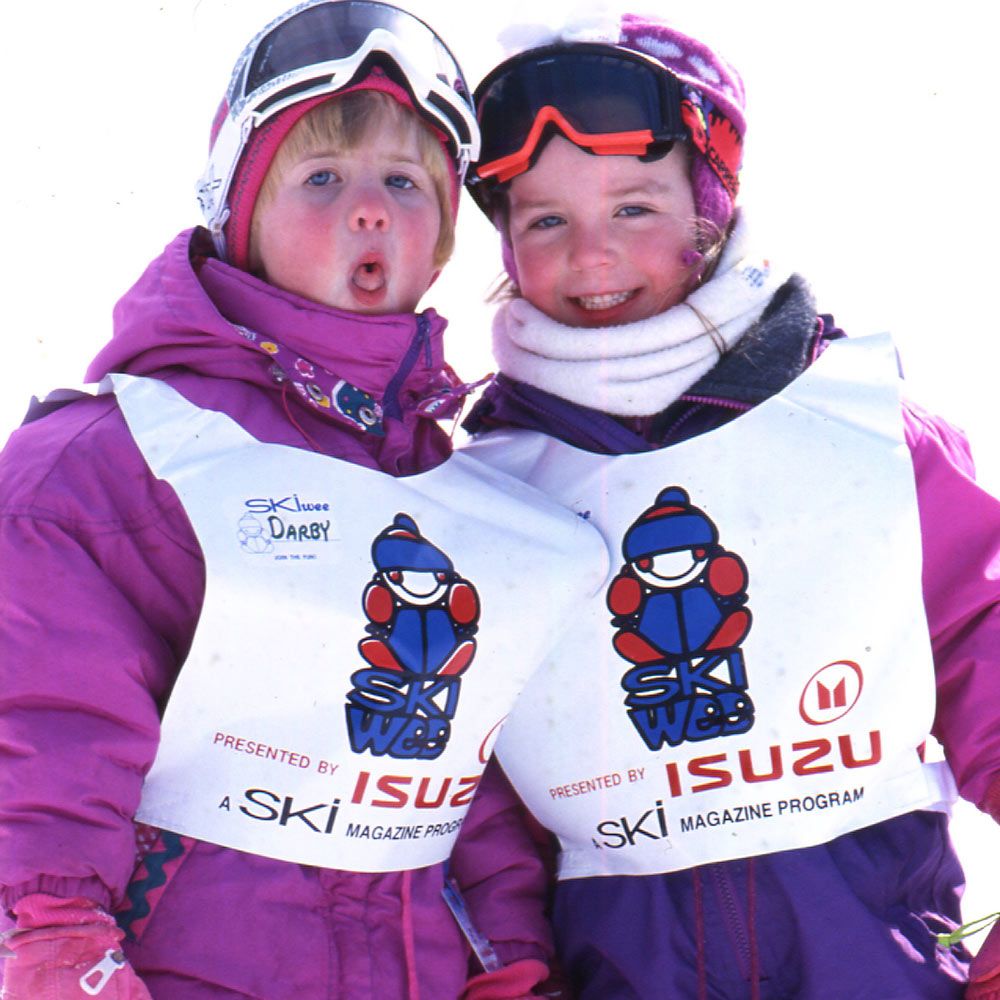 2 little girls having fun together on the mountain