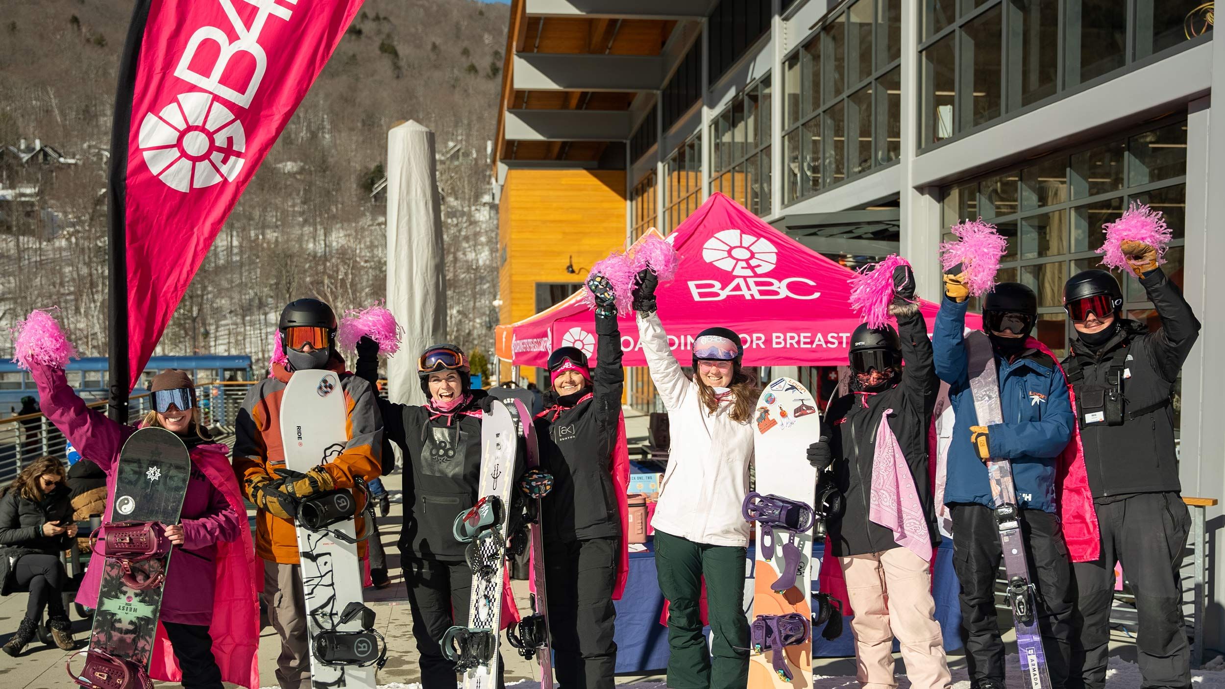 Girl Snowboarding with Pink pom pom