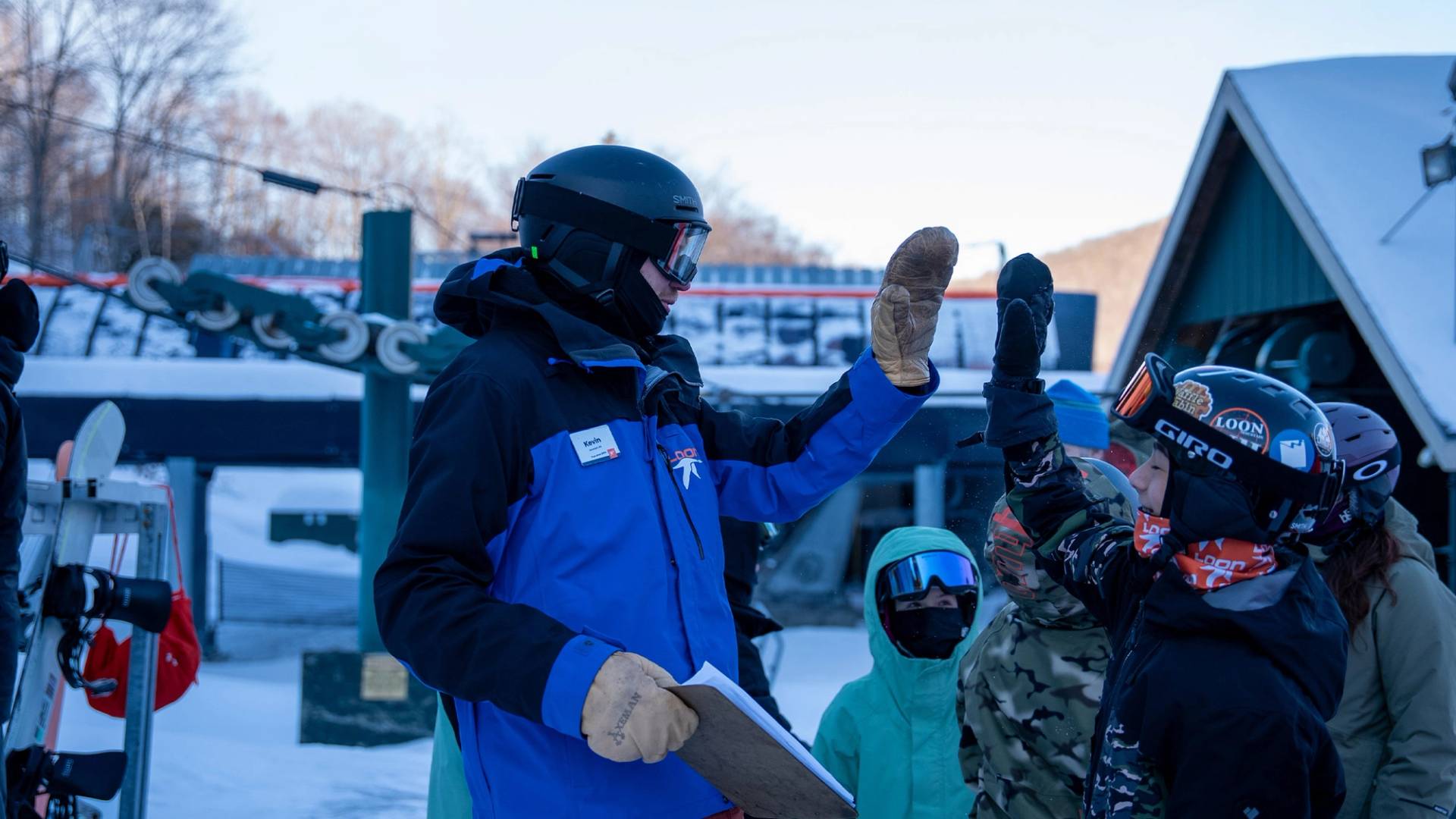 Seasonal program coach high-five students