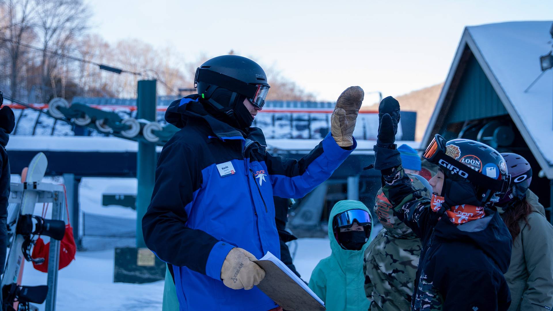 Seasonal program coach high-five students