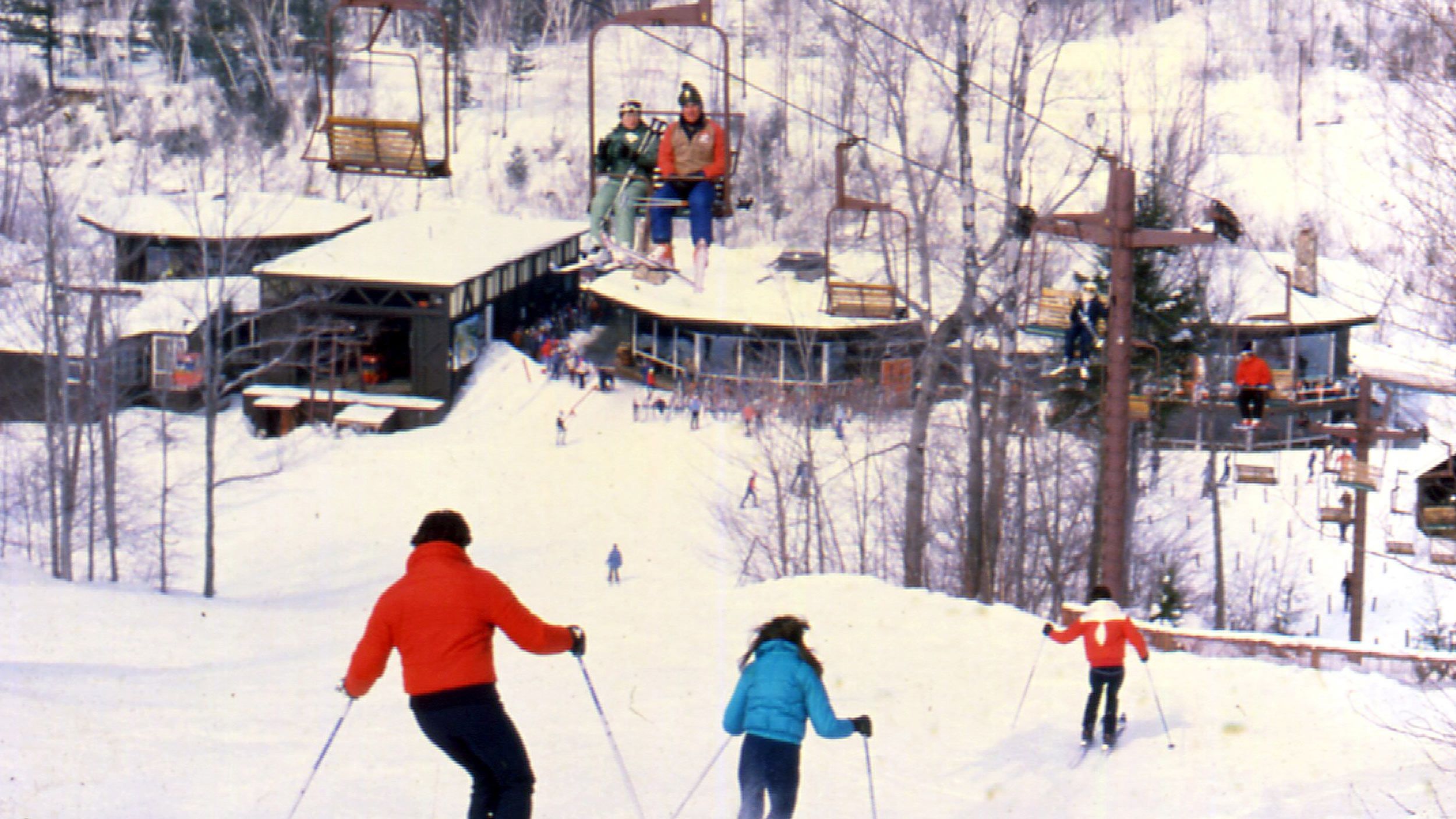 old chairlift image with octagon lodge in the background