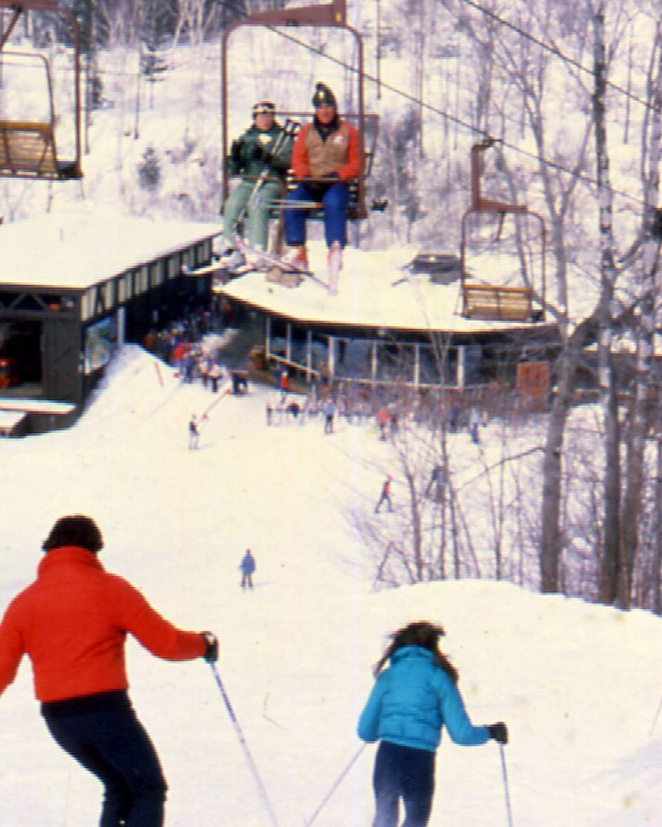 old chairlift image with octagon lodge in the background