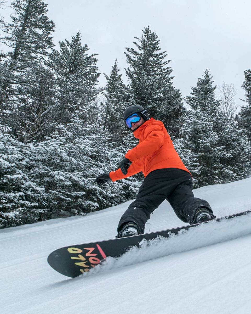 snowboarder in deep powder