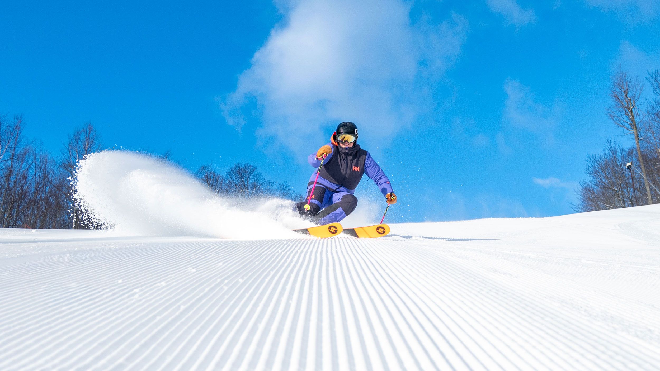 Sunday River skier on corduroy