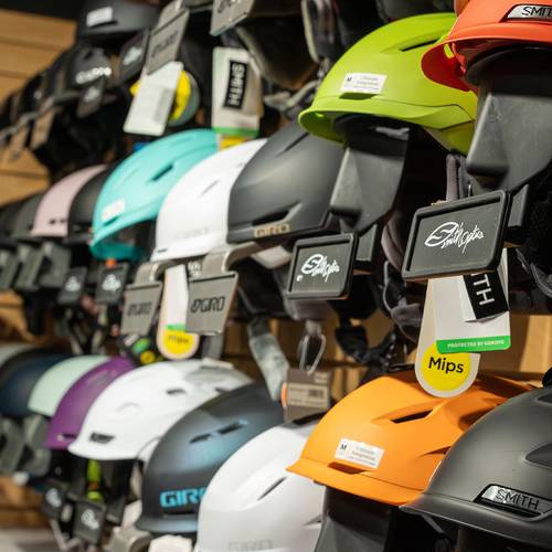 Loon Mountain Sports ski and snowboard helmets on the wall