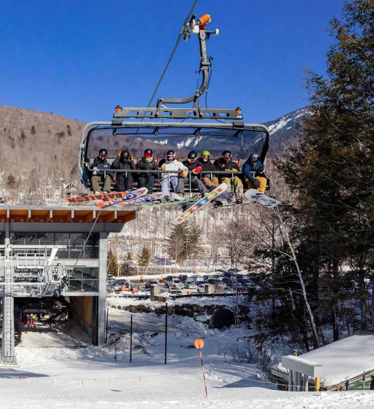 Snowboarders on the Kancamagus 8 chair