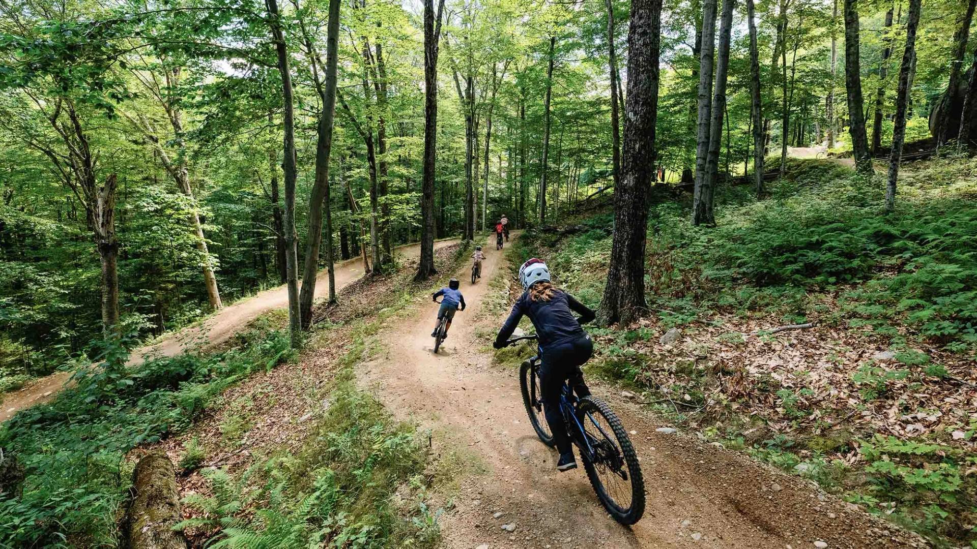 Group of bikers riding a bike park trail at Loon Mountain Resort