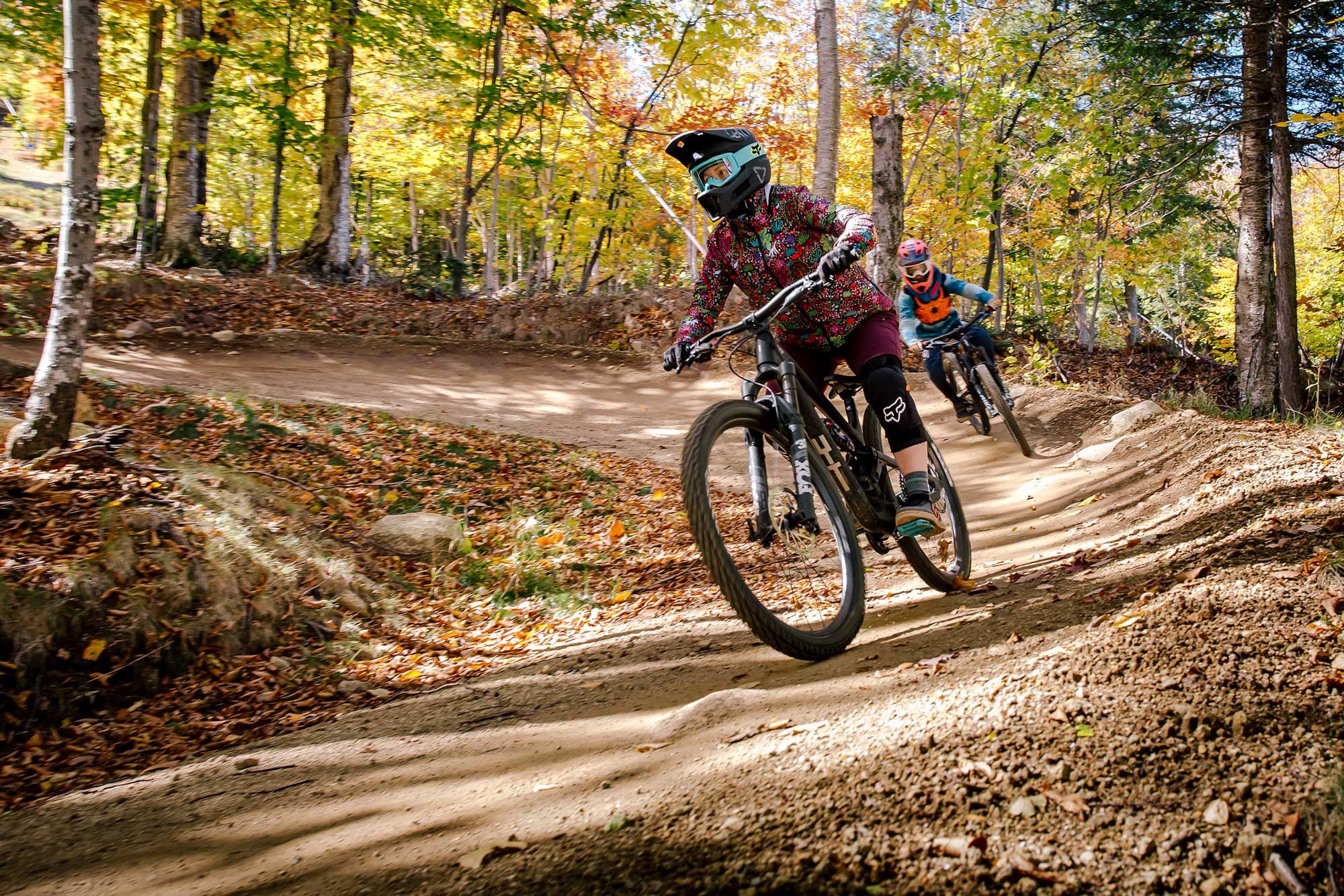 Girl and boy riding one of Loon Bike Park trails