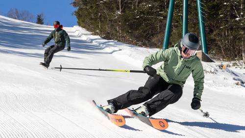 Female skier and male snowboarder at Loon Mountain