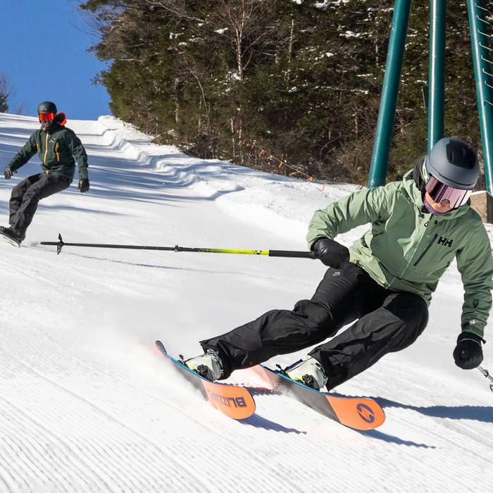 Female skier and male snowboarder at Loon Mountain