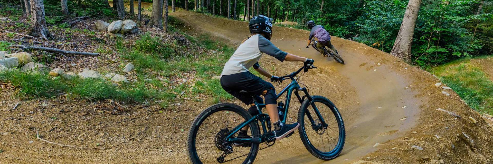 women downhill mountain biking