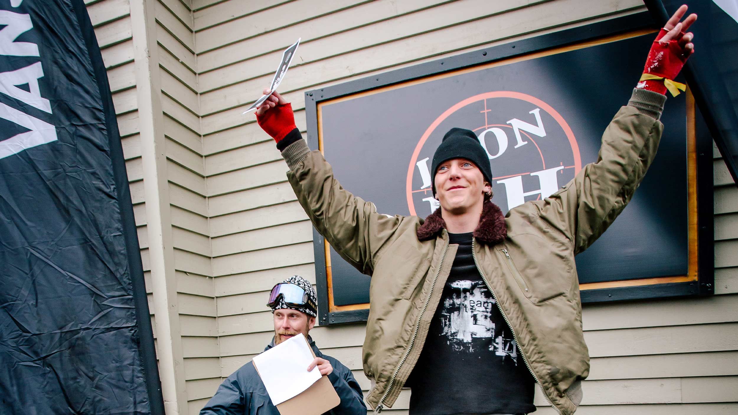 male snowboarder winner on podium