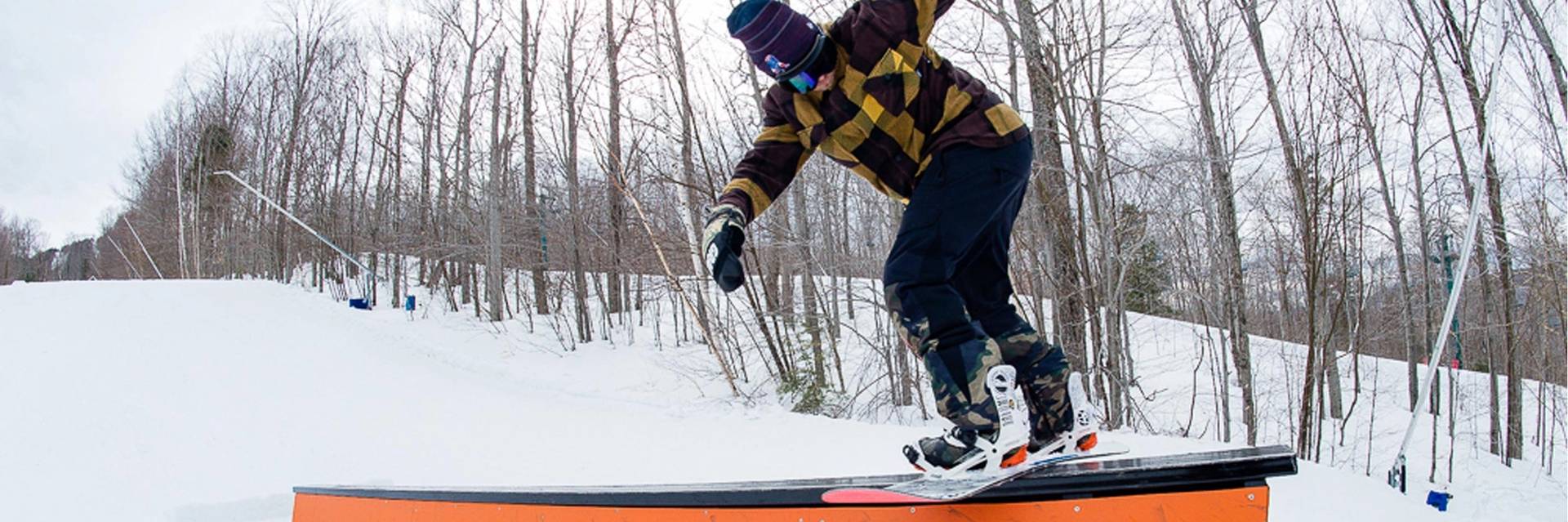 snowboarder riding a flat box