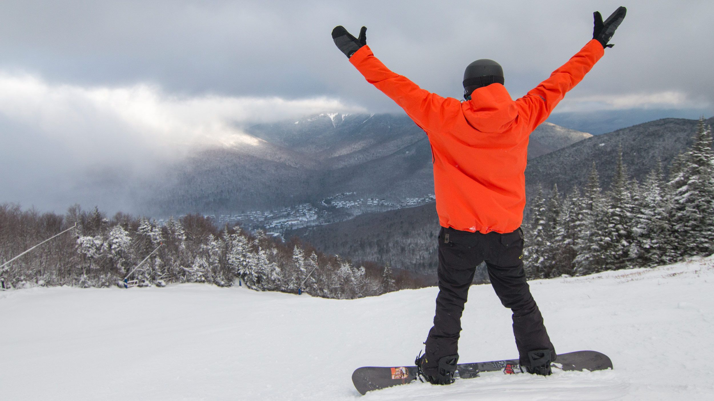 snowboarder with arms in the air