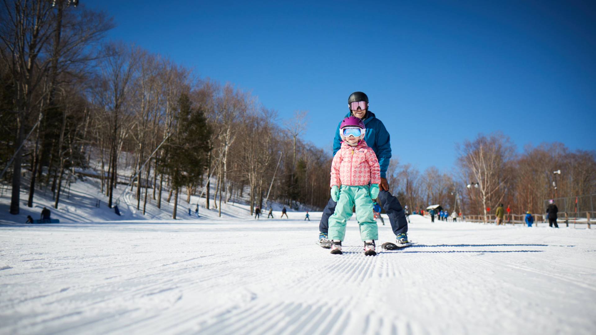 Father and daughter skiing on Sarsaparilla