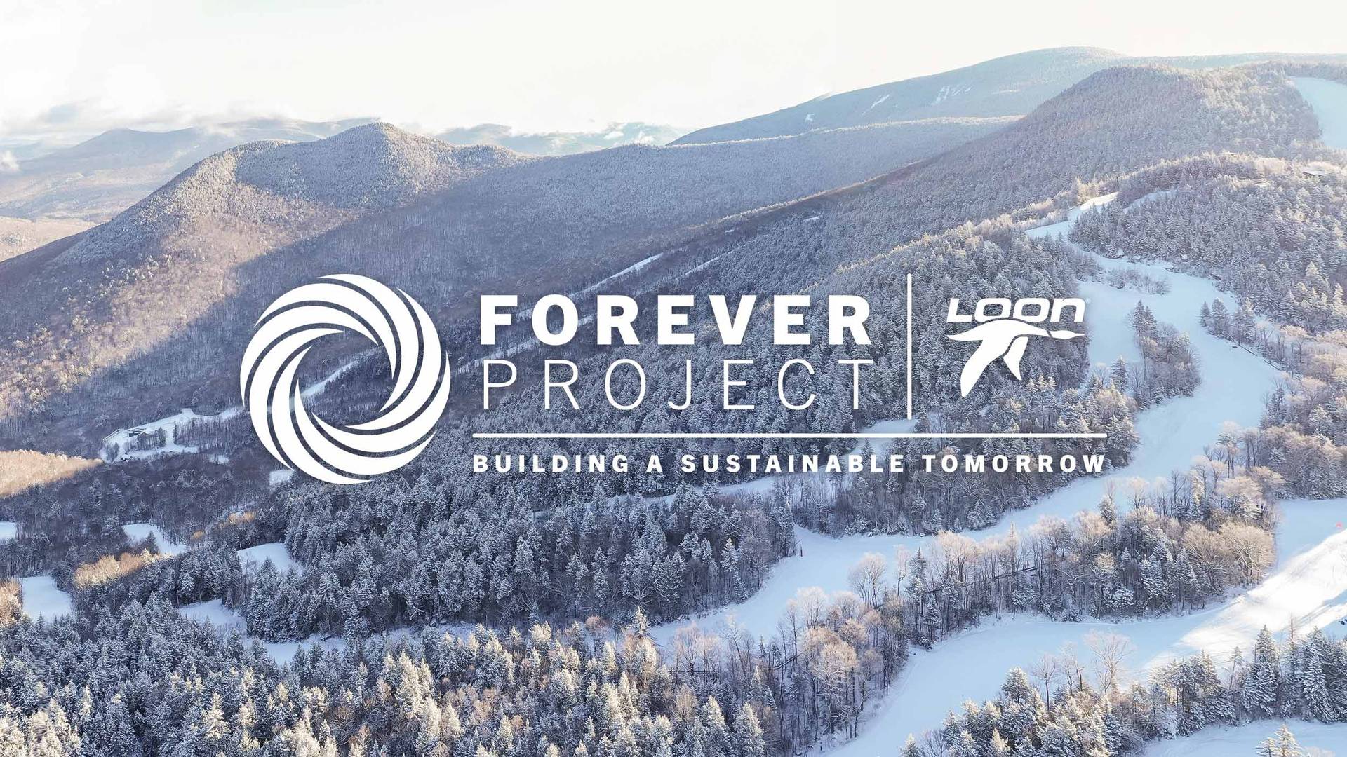 Winter drone shot of Loon Mountain, and Forever Project logo