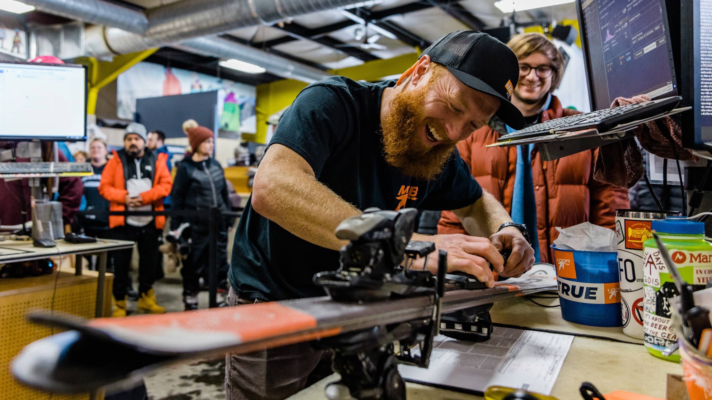 Ski tech working on a ski binding