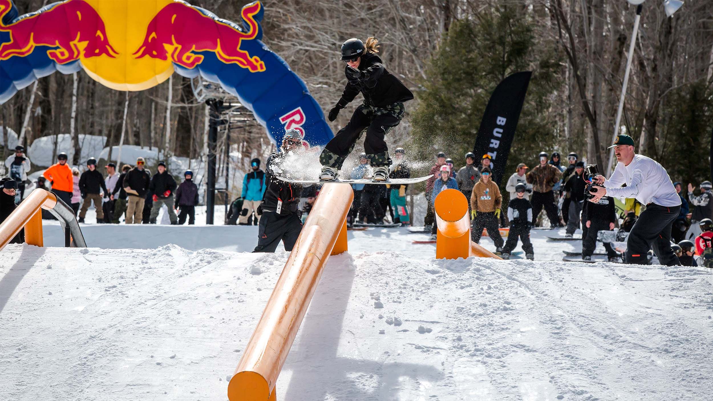 snowboarder sliding on a box in Loon Mountain Park