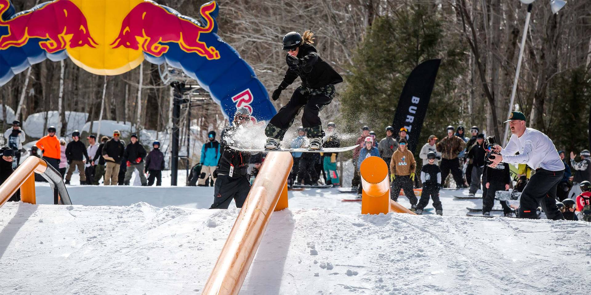 snowboarder sliding on a box in Loon Mountain Park
