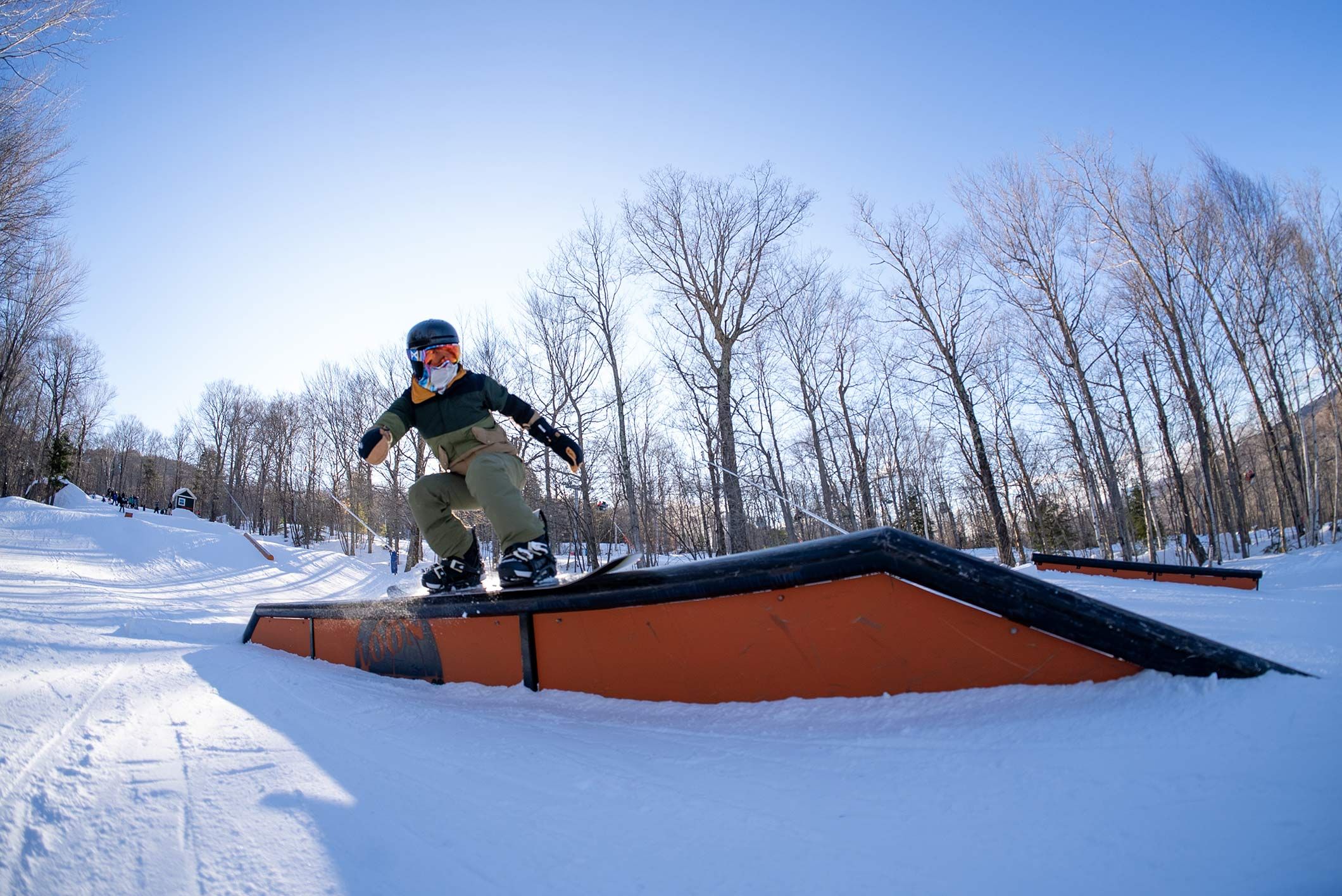 snowboarder riding a flat rail