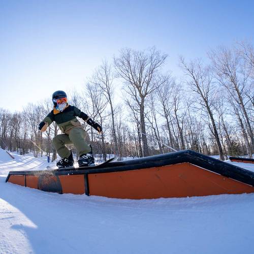 Young snowboarder performing a grab