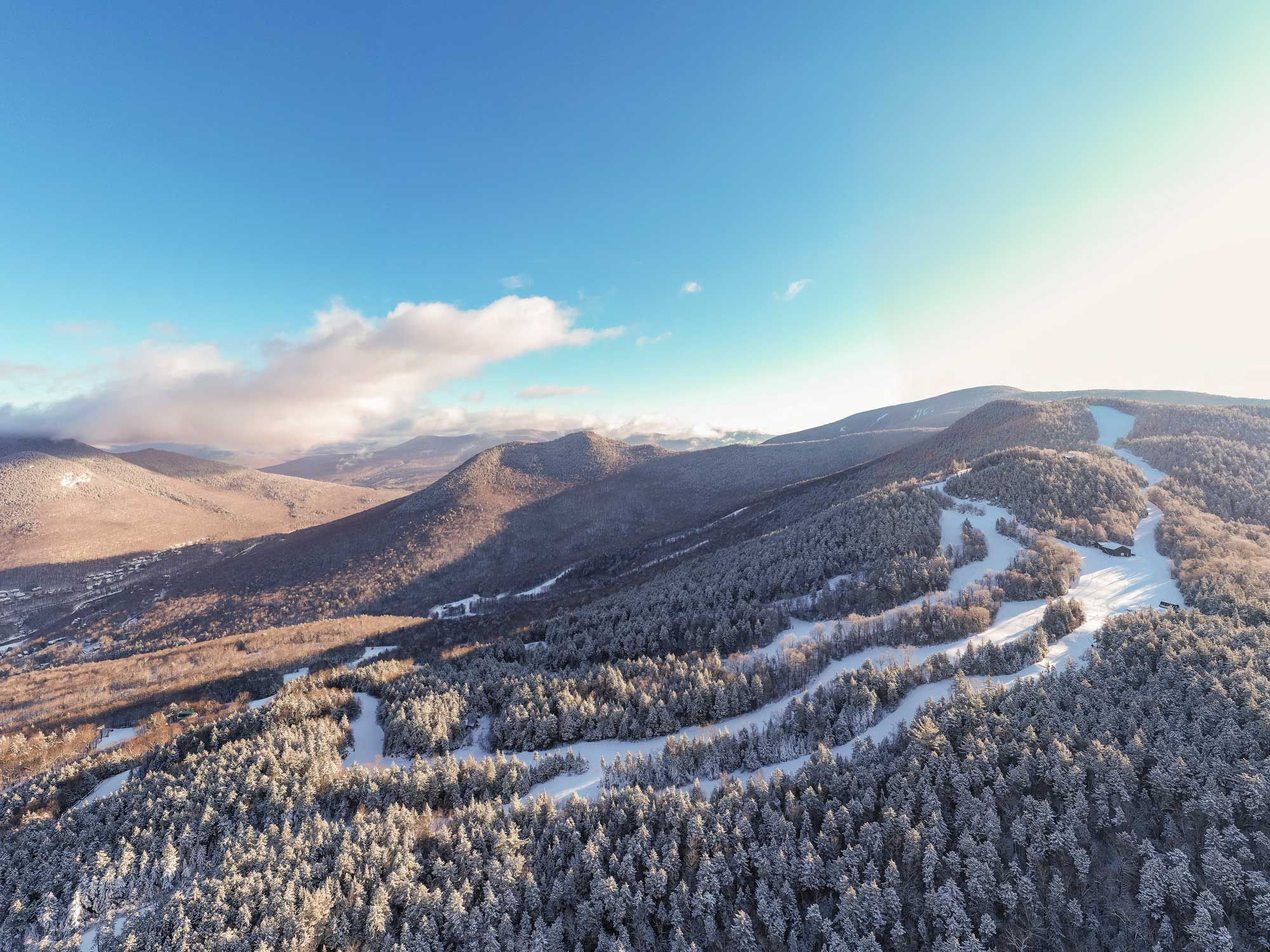 winter drone shot of Loon Peak and North Peak and surrounding mountains