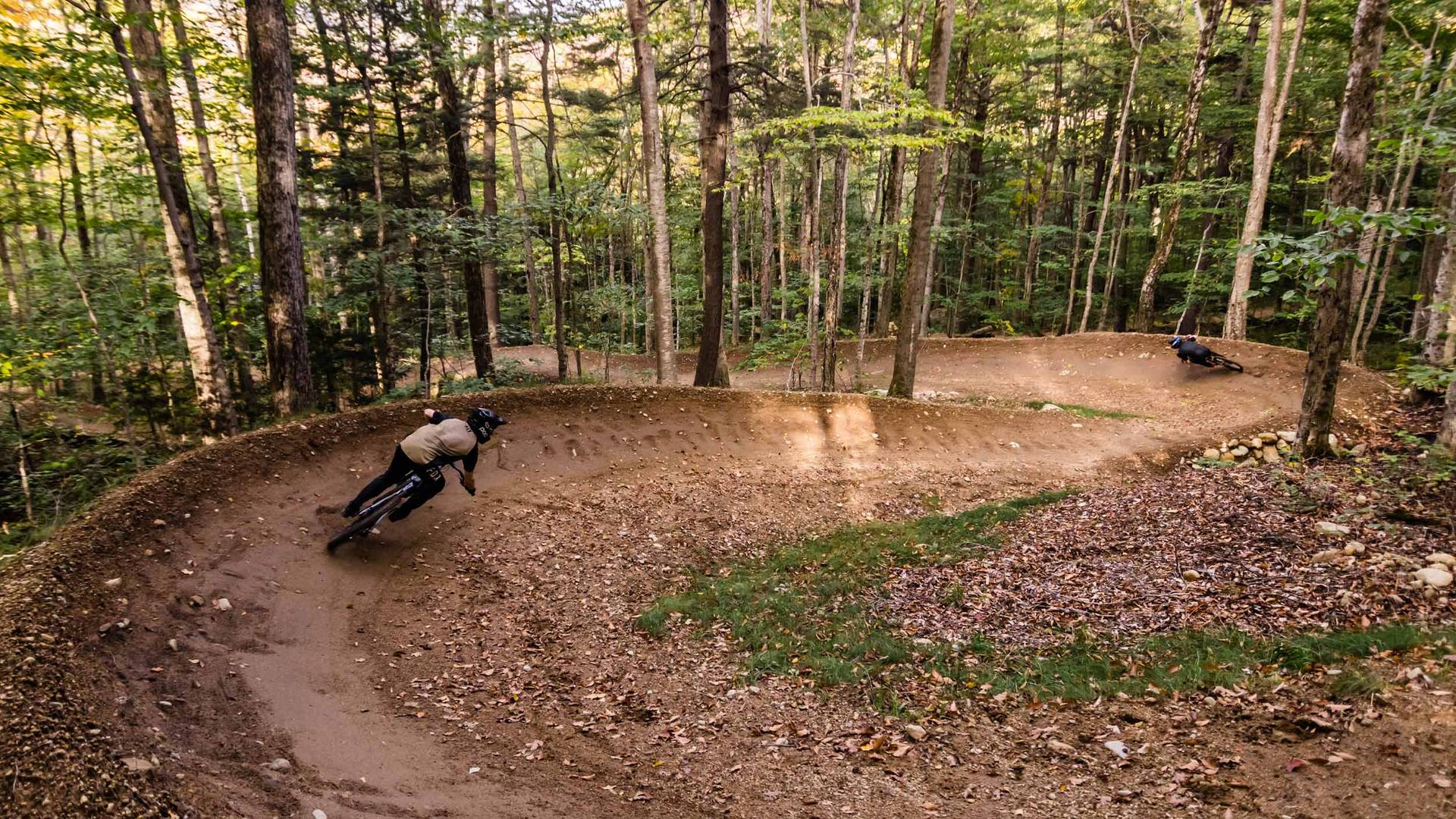 Bikers on Downhill Trails