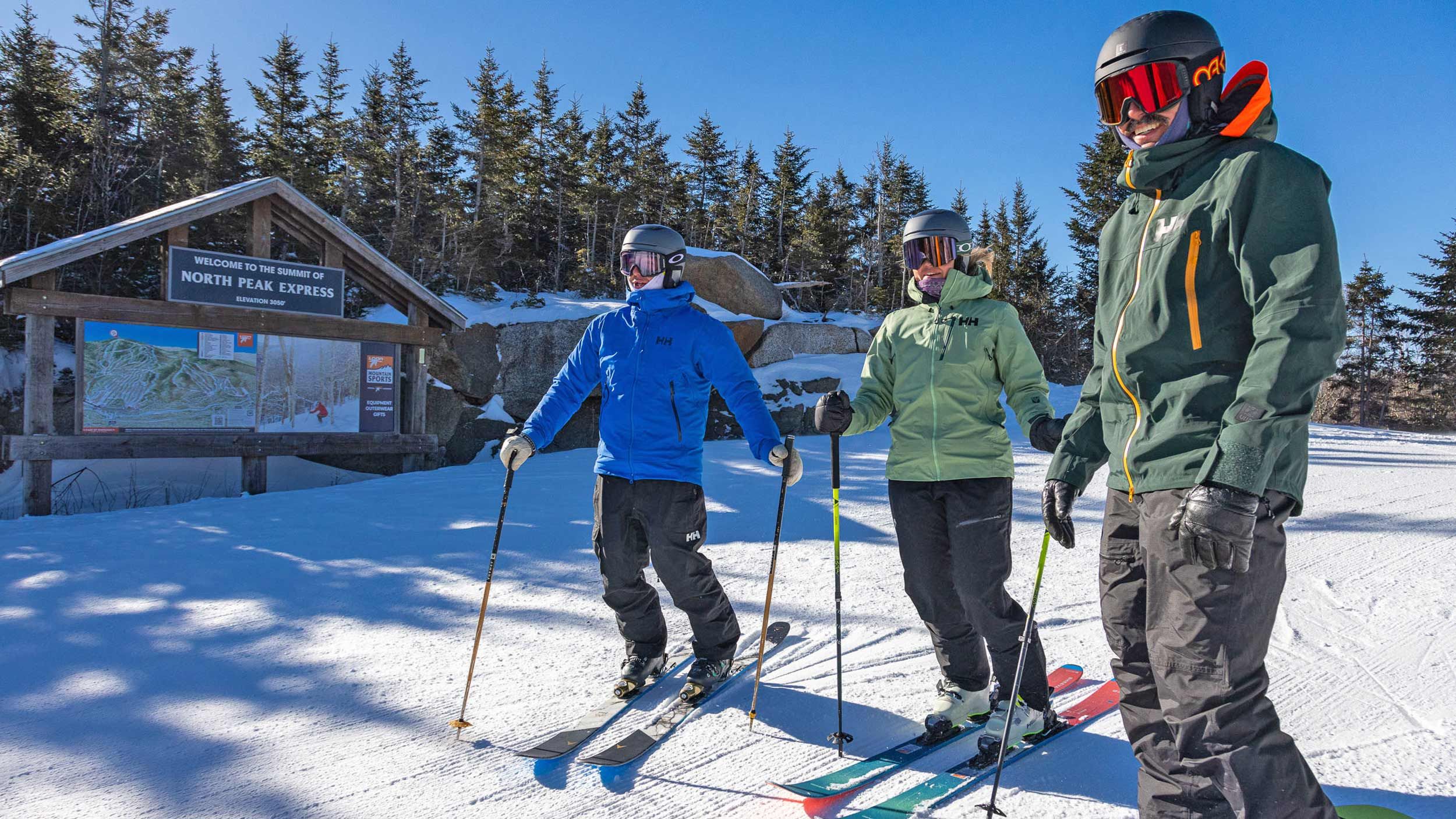 Group of skiers on top of North Peak