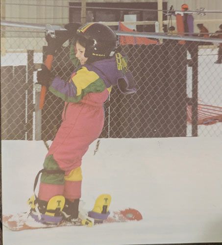 young girl on snowboard
