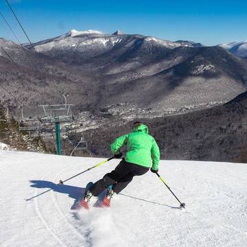 Advanced female skier on steep ski trail at Loon Mountain Resort
