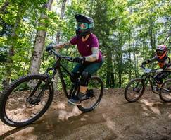 Mother and son riding Loon Bike Park downhill bike trails