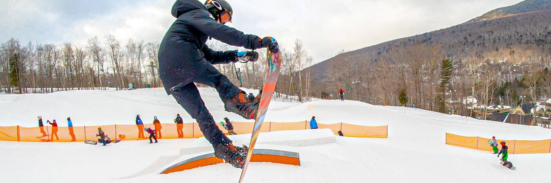 Young snowboarder going off jump at Loon Mountain