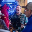 Man Signing at Babe's Blue Ox Lounge