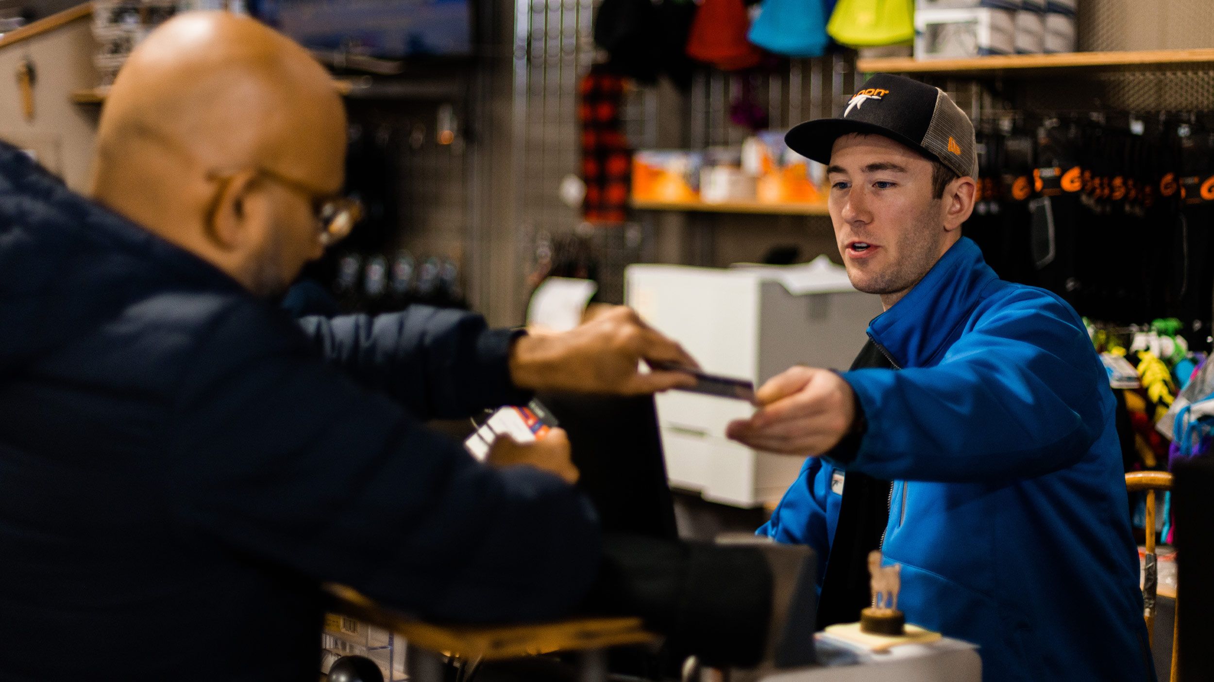 employee and guest doing a transaction