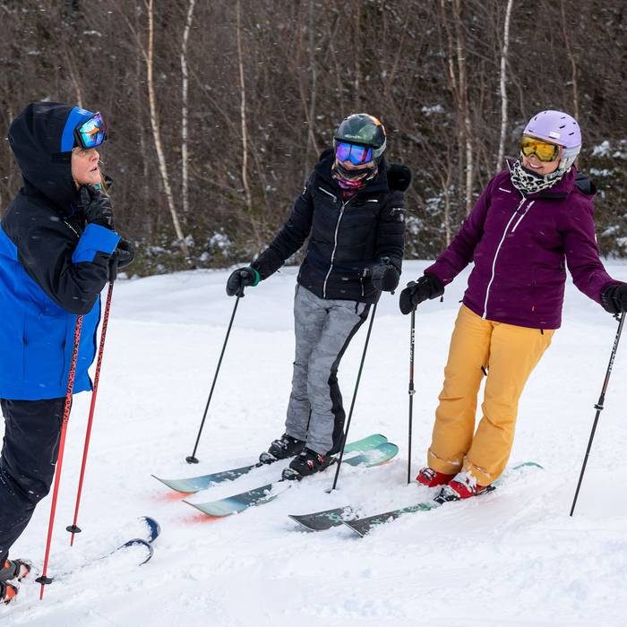 Group of skiers taking a ski lesson at Loon Mountain