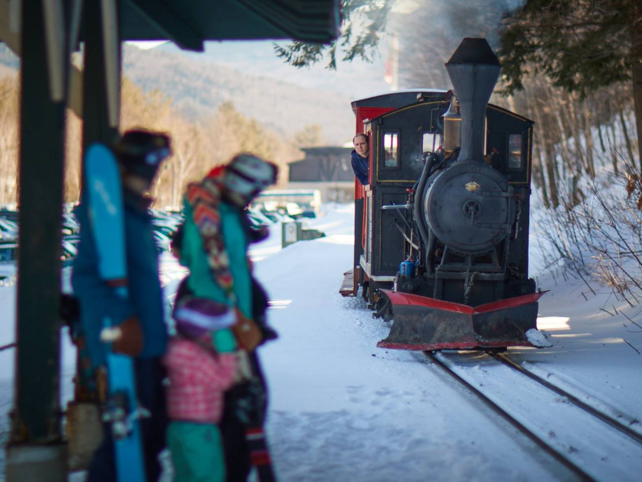 skiers waiting for the train in winter