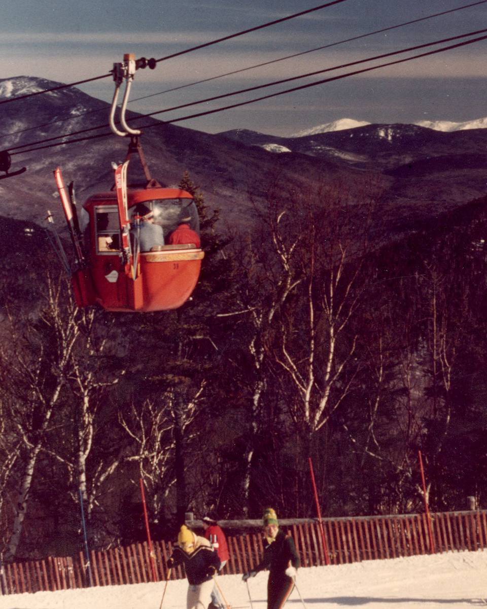 gondola with skiers underneath