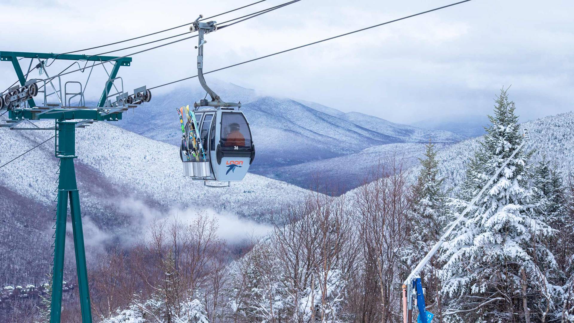 Winter gondola skyride with ski passengers